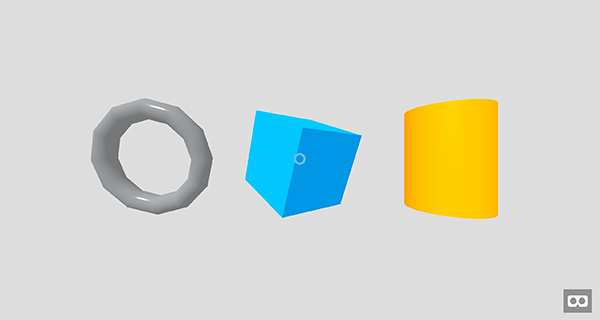 Illustration of three 3D geometry shapes: a gray torus, a blue cube, and a yellow cylinder.